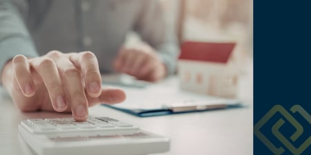 Homeowner reviewing mortgage payment reduction options with financial documents.